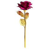 Red gold plated rose with gold stem and leaves on white background