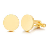 Pair of gold round cufflinks with slightly domed polished faces on white background