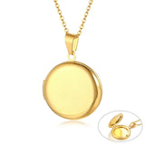 Plain gold round photo locket with inset image showing it opened to hold two photos