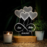 Etched night light with heart balloon design, two names and a date on a wooden base
