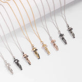 Row of hugging couple pendant necklaces shown in multiple metal color options