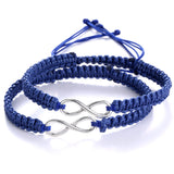 Navy blue braided rope bracelet with a silver infinity charm