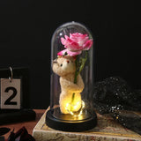 Blue galaxy foil rose glowing under a glass dome on a black base