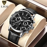 Black dial chronograph with silver case, white markers and black leather strap in box
