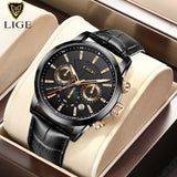 Black dial chronograph watch with gold sub-dial rings and black leather strap