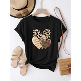 Black t-shirt with cream heart outline graphic shown on a hanger