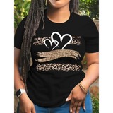 Black cotton t-shirt with leopard print heart and hands forming a heart shape worn outdoors
