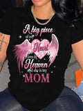 Black t-shirt with pink wing heart and Mom text graphic worn close-up
