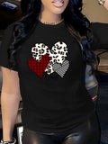 Black t-shirt with skull and red heart graphic worn close-up