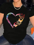 Black t-shirt with colorful tie-dye heart graphic worn close-up