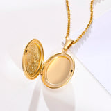 Gold oval locket opened to show two empty photo compartments inside