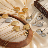Gold and silver heart and oval lockets arranged on a curved wooden display board
