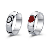 Silver heart engraved rings shown with one featuring a red gemstone accent