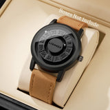 Black magnetic ball watch with light tan leather strap in a display box