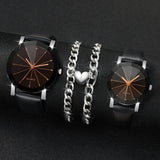 Two black leather strap watches with a silver heart charm bracelet on dark background