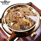 Close-up of the gold skeleton watch dial showing exposed gears and movement