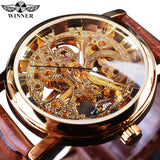 Gold case skeleton watch with exposed gears and brown leather strap