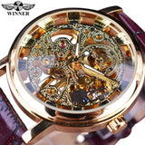 Gold case skeleton watch with a different gear pattern and brown leather strap