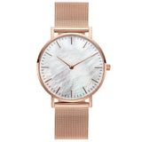 Rose gold mesh watch with white pearl dial on white background