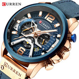 Rose gold chronograph watch with blue dial and blue leather military strap