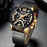 Angled view of the rose gold chronograph watch with blue dial and leather strap