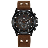 Black dial military watch with orange accents and mid brown leather strap