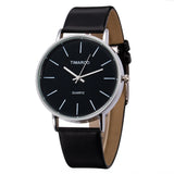 Front view of black dial watch with silver case and black strap