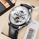Automatic moon phase watch with black skeleton dial and black leather strap