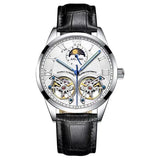 White skeleton dial watch with silver case, moon phase display and black leather strap