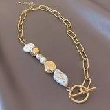 Gold chain bracelet with freshwater pearl beads and circle toggle clasp