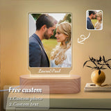 Custom photo lamp of a couple displayed on a shelf beside a vase and dried stems