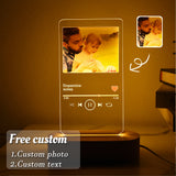 Backlit acrylic photo plaque on wooden base shown with colour changing remote control