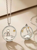 Silver prince and fox pendant necklaces layered together casting shadows on white background
