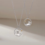 Close-up of the silver fox pendant necklace with circular frame design