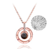 Silver circle pendant necklace with projection charm design