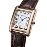 Rose gold case rectangular watch with white dial and brown leather strap