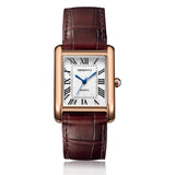 Rose gold case rectangular watch with white dial and brown leather strap on white background