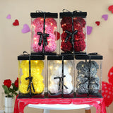 Display of boxed rose flower teddy bears in pink, yellow, red and black with roses