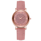 Front view of rose gold watch with pink dial and dusty pink suede strap