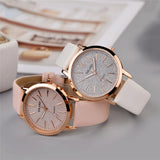 Two rose gold women's watches with textured dials and pale straps side by side