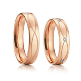 Rose gold plain wedding ring pair without crystal accent on white background