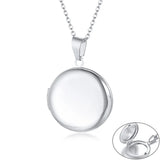 Plain polished silver round photo locket on a fine silver chain