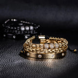 Black three piece bracelet stack with crystal charm on dark background