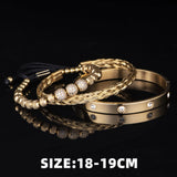 Gold three piece bracelet stack shown on black background with size measurement label