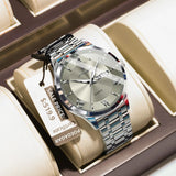 Silver watch with grey dial and steel bracelet displayed in a presentation box