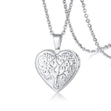 Silver heart photo locket with intricate filigree scroll pattern on a fine chain