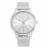Front view of silver mesh watch with white dial and thin silver baton markers