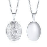 Two silver oval photo lockets side by side, one floral engraved and one plain