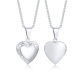 Two silver heart photo lockets on chains, one with etched pattern and one polished plain