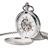 Silver mechanical pocket watch open to show skeleton dial and chain on white background